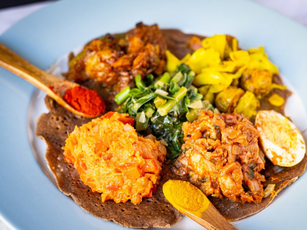 Ethiopian food cuisine traditional setting kong hong cosmopolitan michelin mira star restaurants shoppeblack gomen